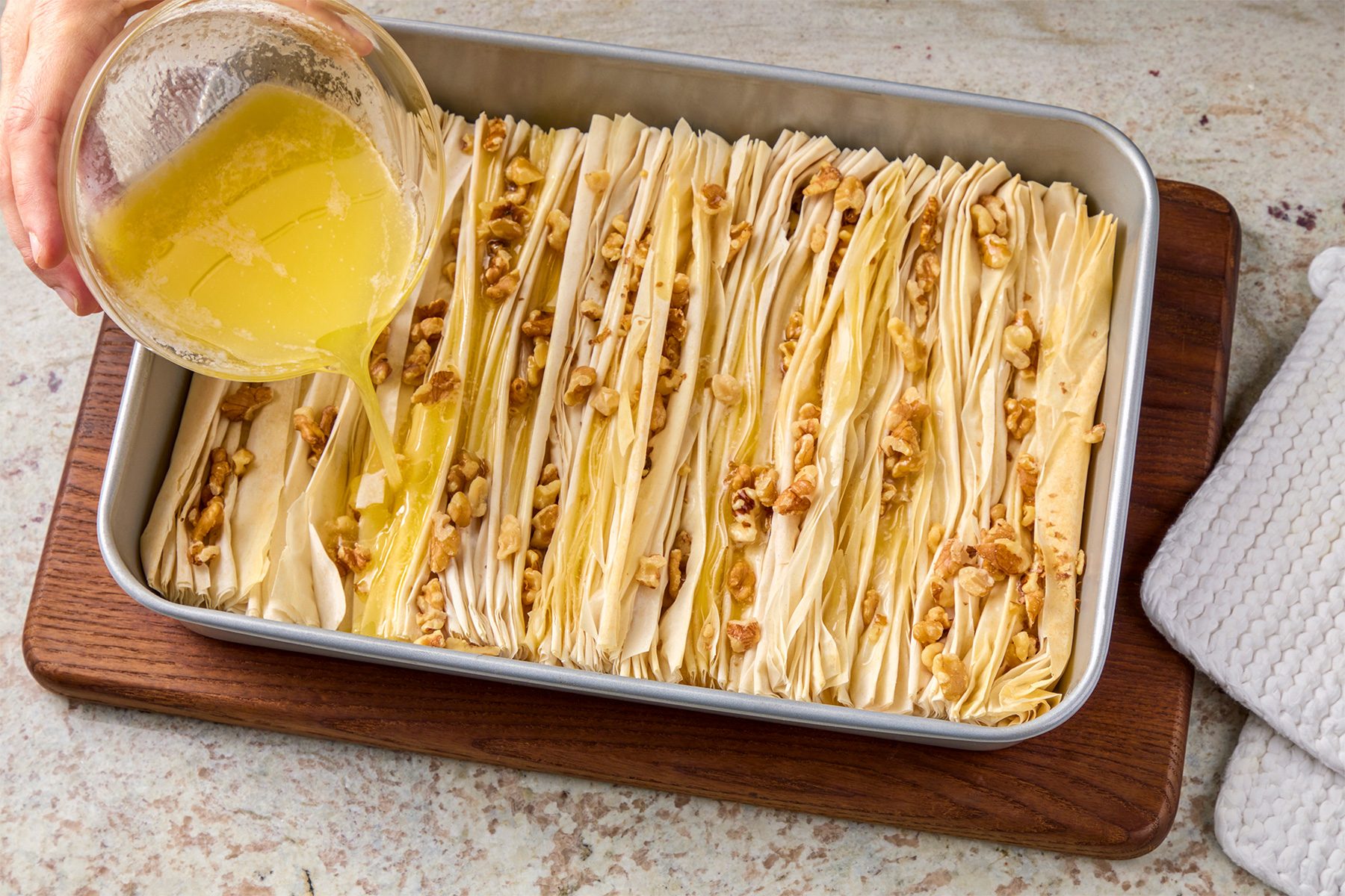 Drizzle melted butter evenly on top.