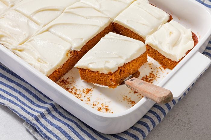 3/4th angle shot of Pumpkin Spice Cake with Cream Cheese Frosting.
