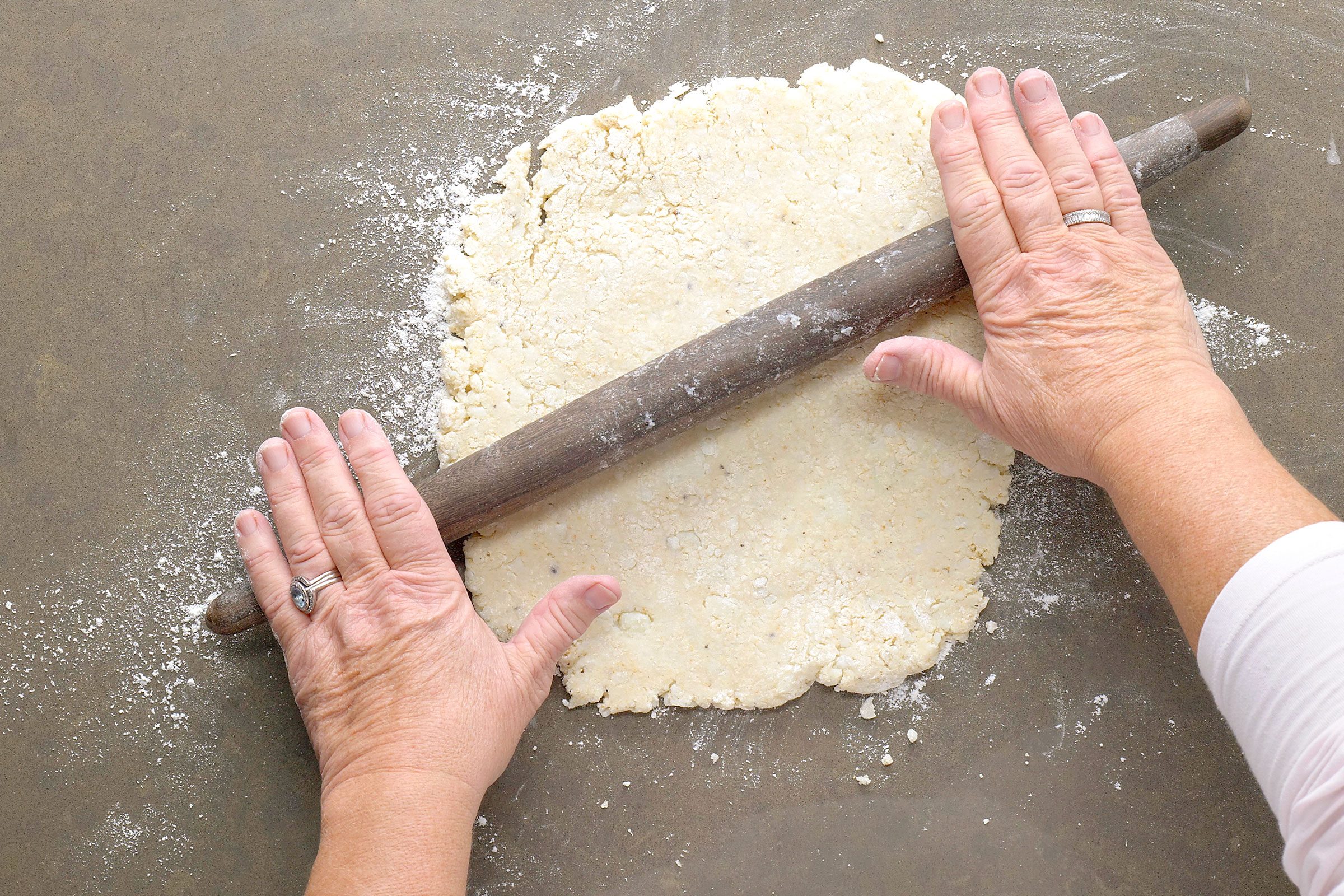 Rolling potato dough with a rolling pin