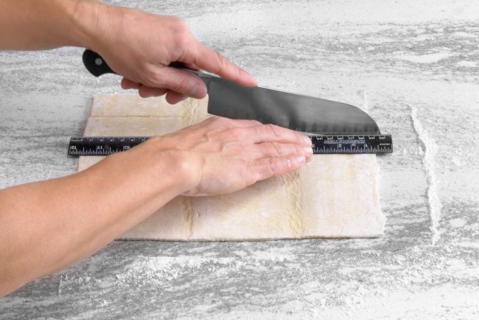 Cutting the pastry dough sheet using a sharp knife