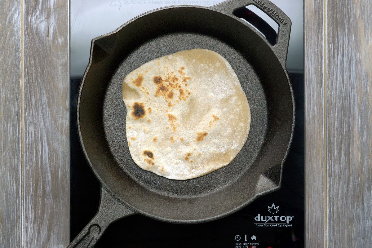 In a large cast-iron or other heavy skillet, cook breads