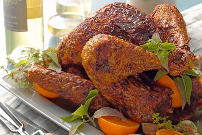 Deep Fried Turkey on a plate, accompanied by a knife and fork