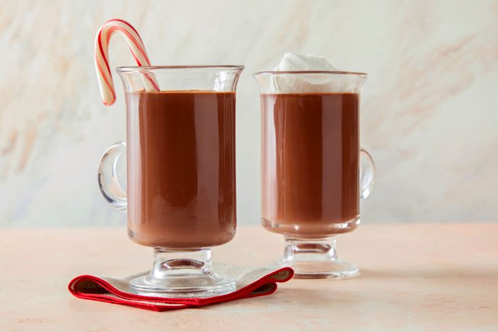 Rich Peppermint Hot Chocolate served in two glasses with ice cream topping