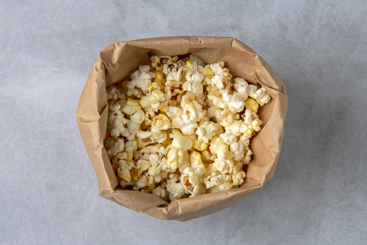 popcorn inside brown paper bag