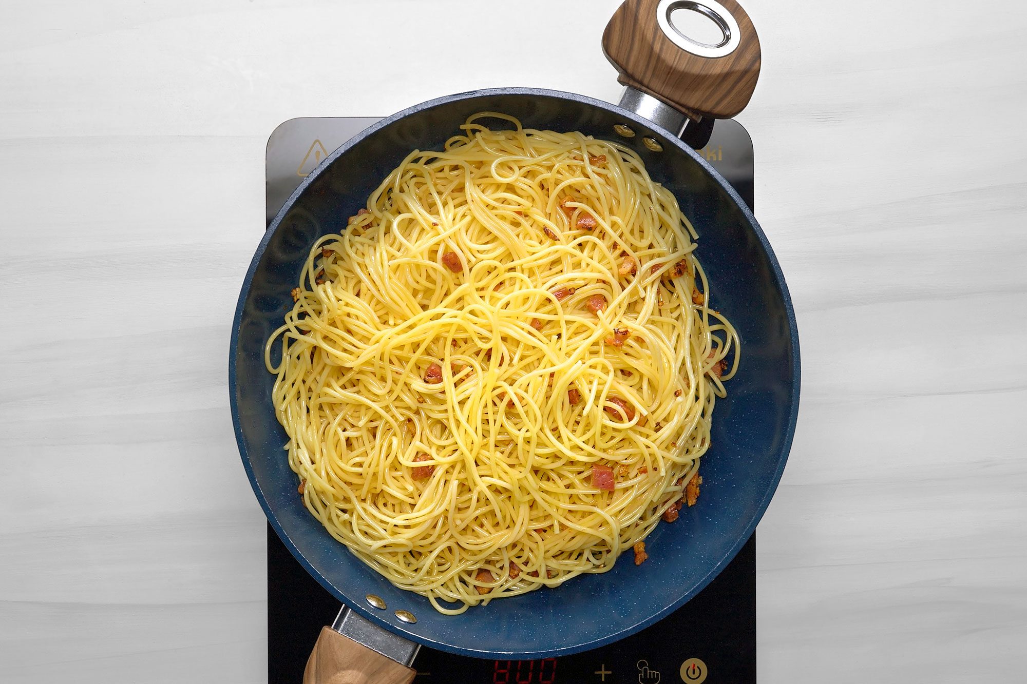 Add spaghetti to skillet