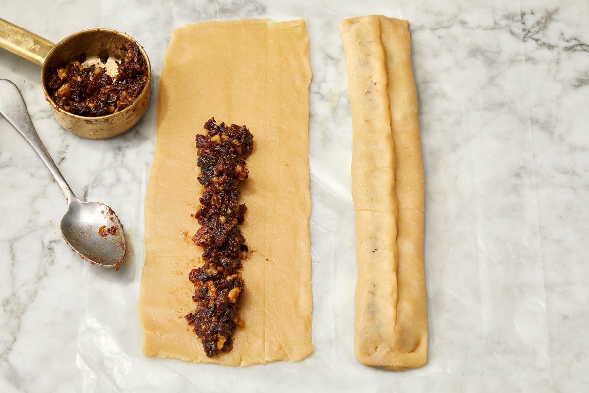 Spread 1/2 cup filling down the center of each rectangle. Starting at a long side, fold dough over filling; fold other side over top. Pinch to seal seams and edges