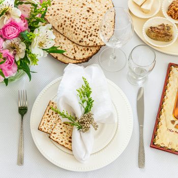 Table setting for passover with flowers