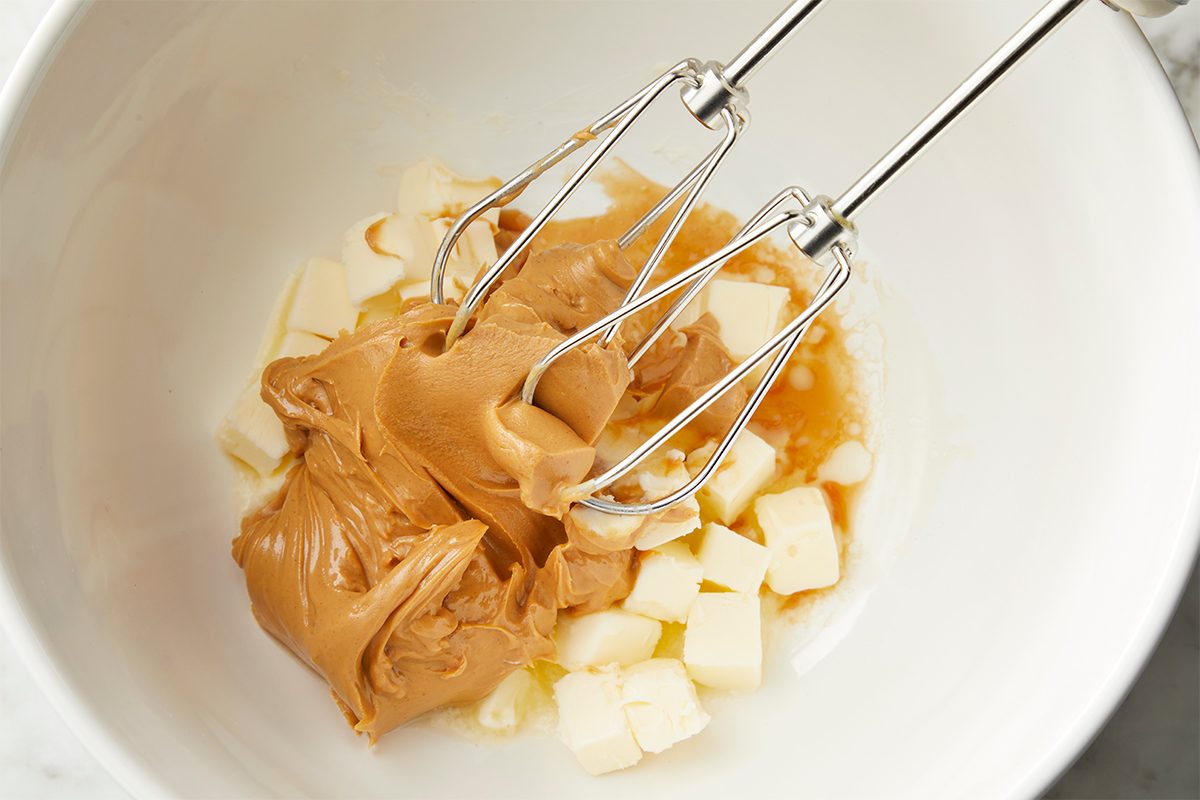 In a large bowl, beat peanut butter, butter and vanilla until blended.