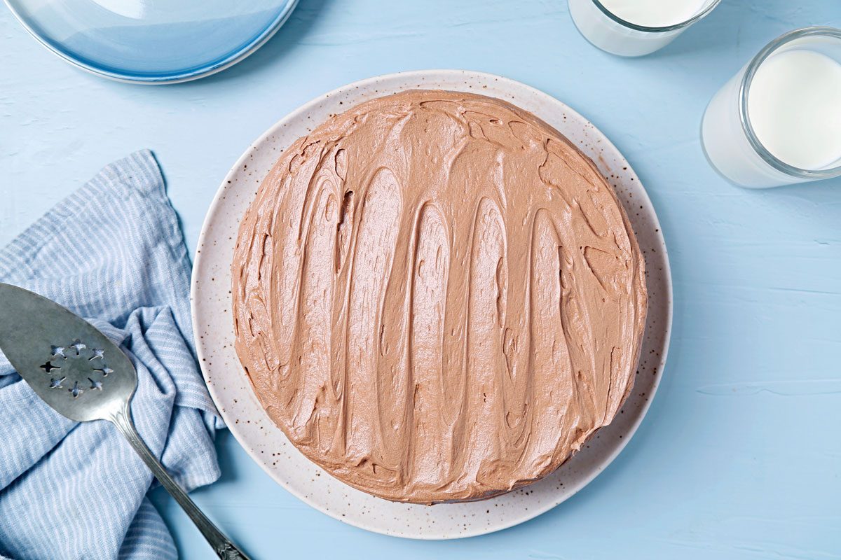 Vegan cake frosted with chocolate vegan frosting.