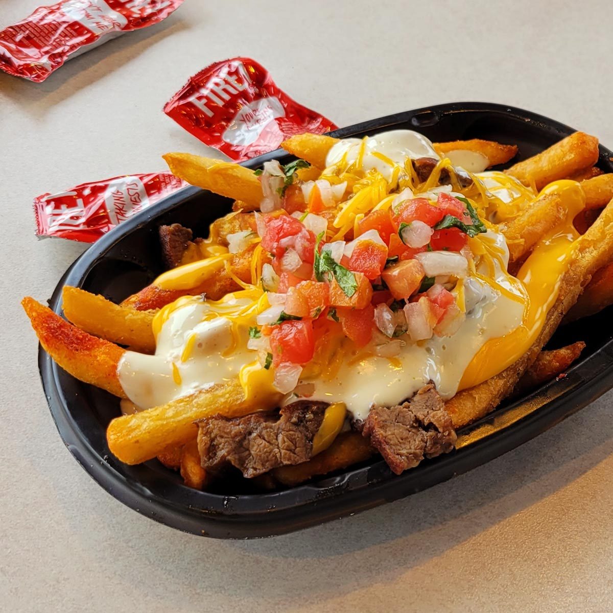 I Ordered Taco Bell’s Steak Garlic Nacho Fries, and I Have Thoughts