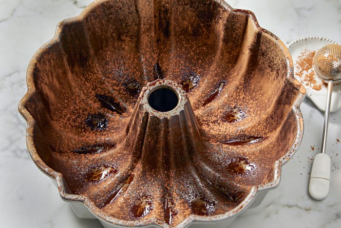 Grease a fluted tube pan; dust with cocoa powder