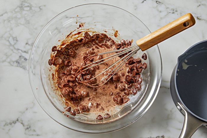 place chocolate chips in a small bowl. In a small saucepan, bring cream just to a boil.