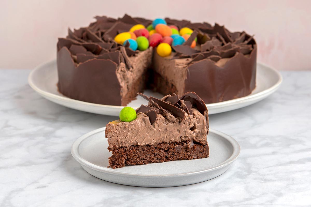 A slice of easter nest torte with candy eggs