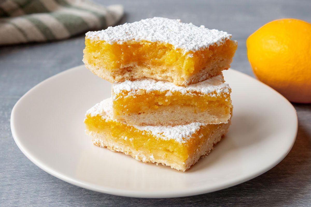 Meyer Lemon Bars stacked on a plate