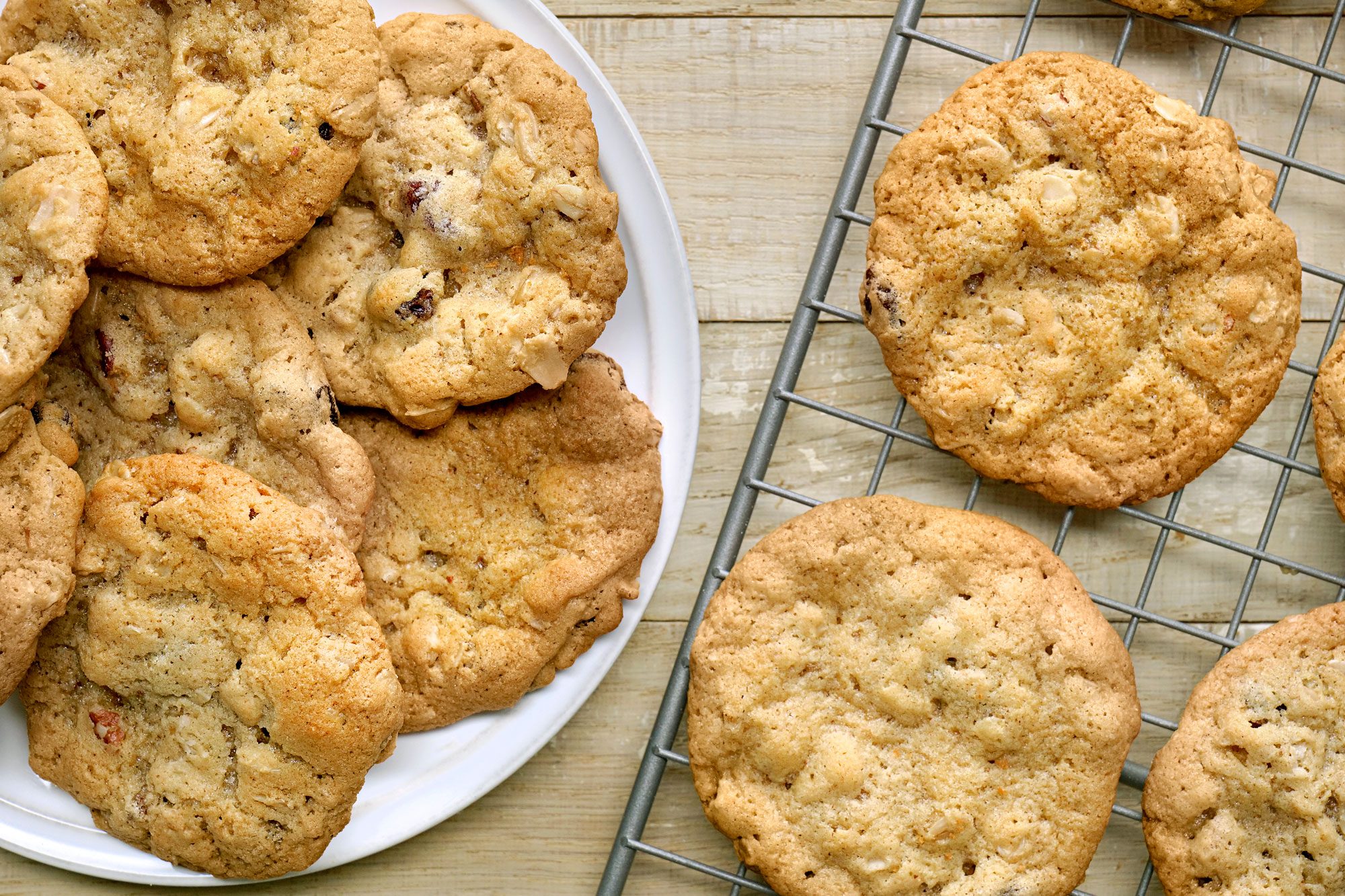 Overhead shot of Oatmeal Raisin Cookies; remove to a wire rack to cool; serve on plate; wooden surface;