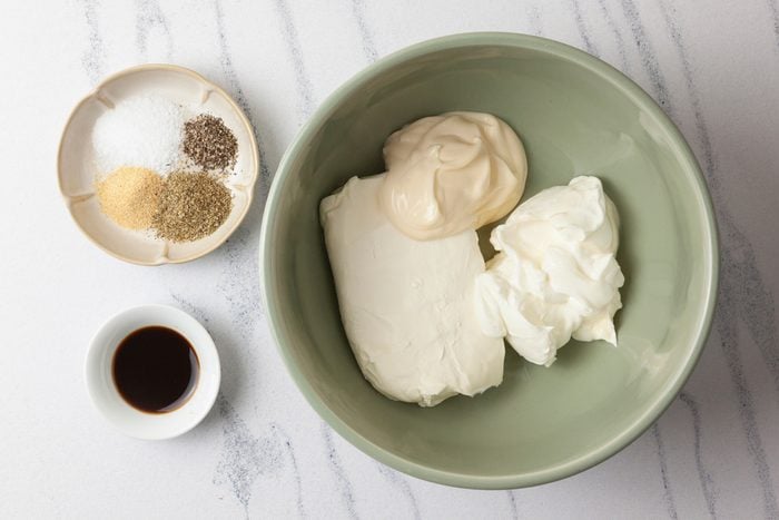 Combine the cream cheese, sour cream, and mayonnaise in a large bowl