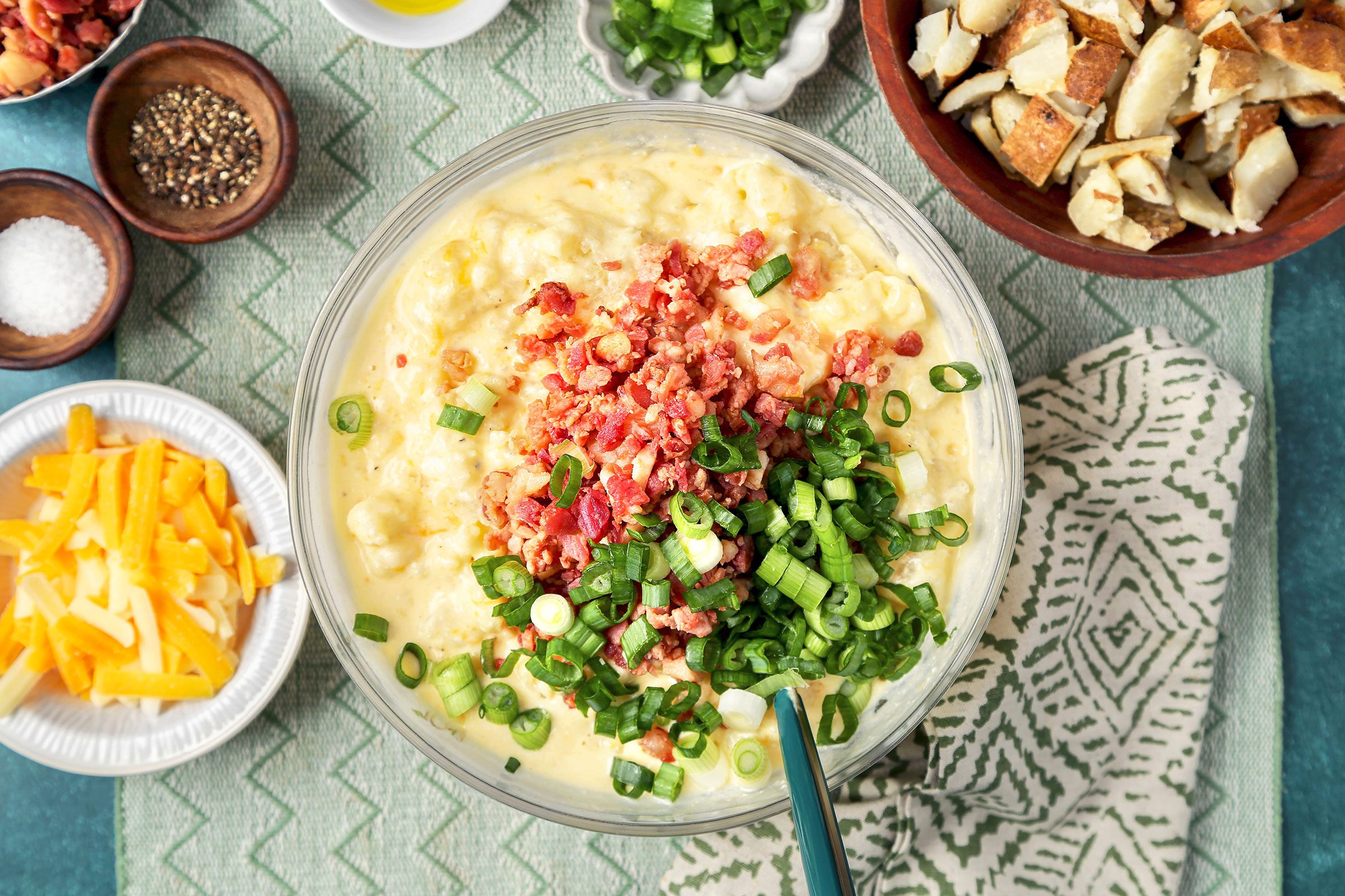 Mashed potato and cheese mixture with green onions and bacon