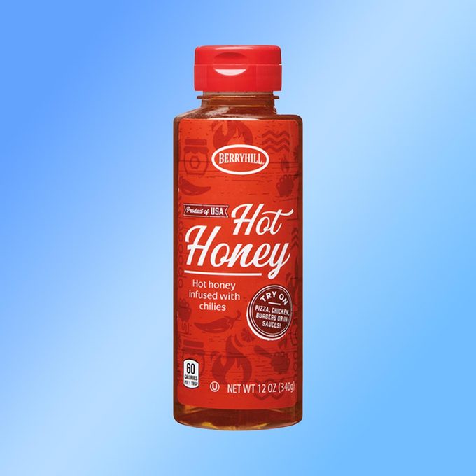 Berryhill Hot Honey container on a blue background