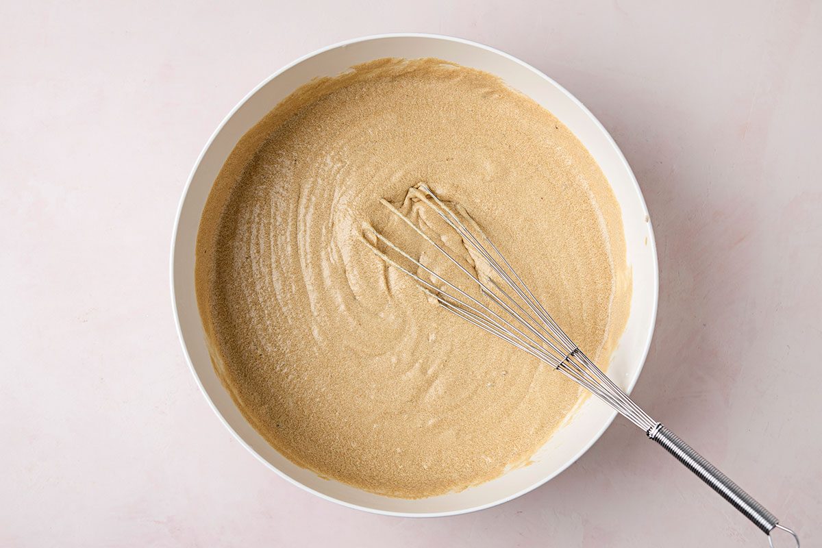 Ingredients mixed in a bowl for a caramel cake