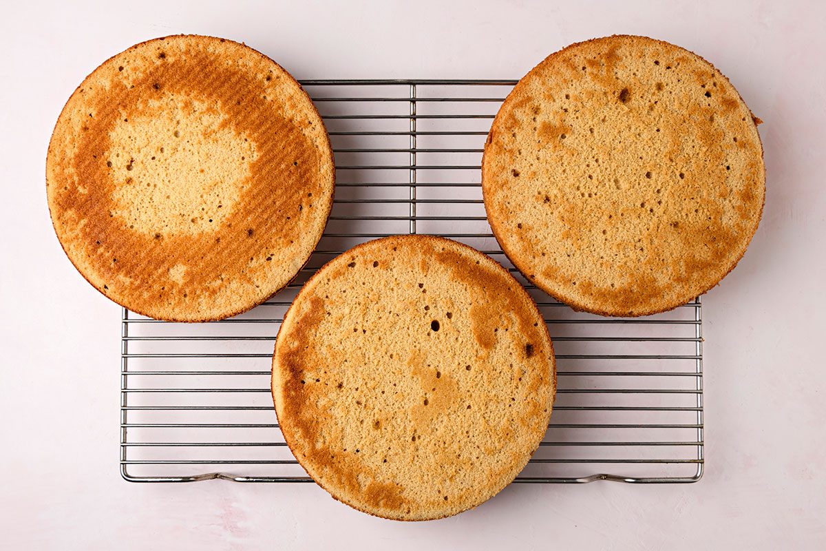 Baked cake cooled on a wired rack.