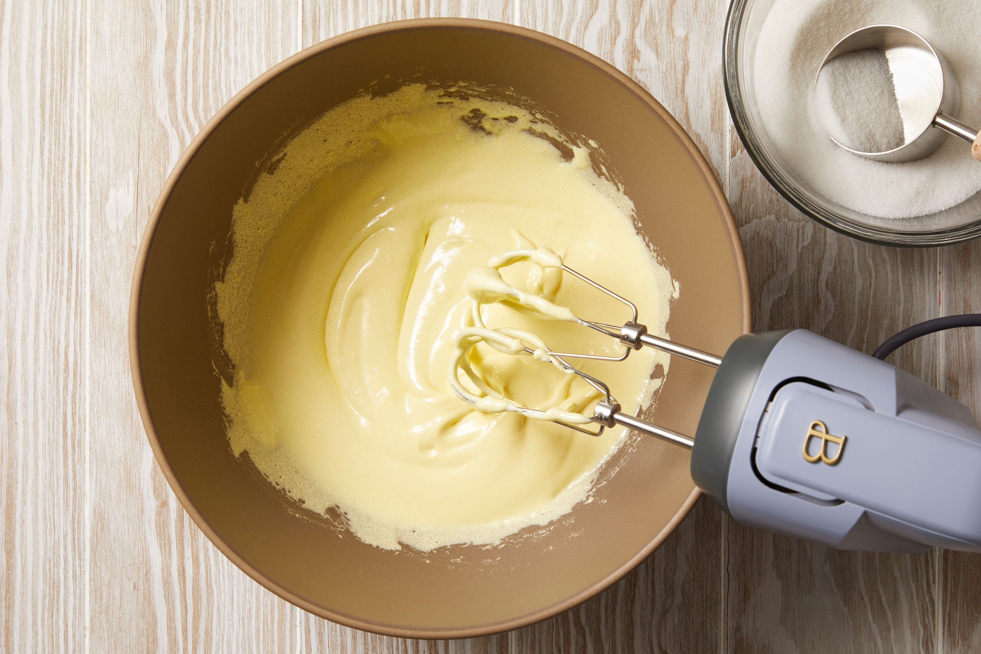 In a large bowl, beat egg yolks on high speed,