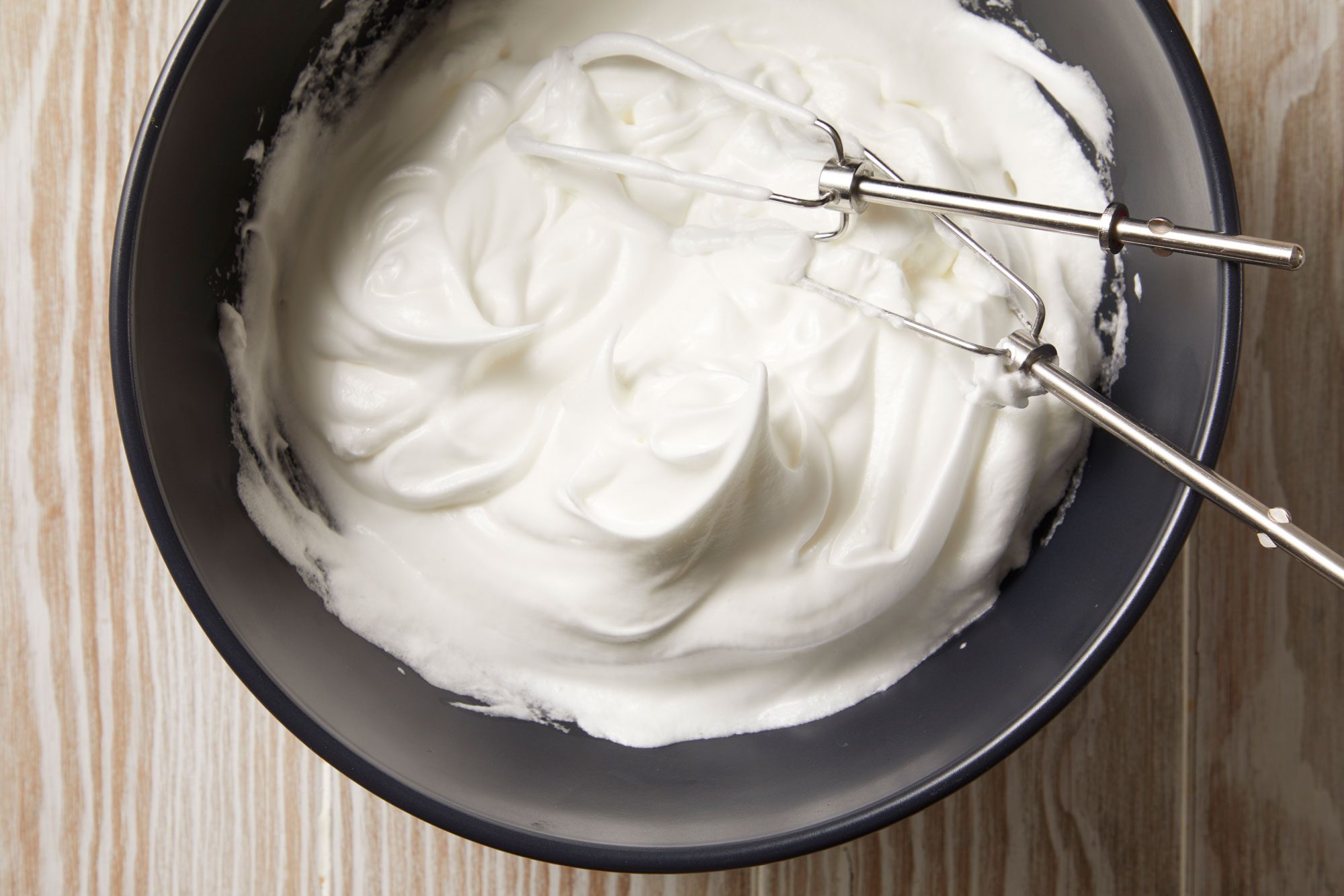 With clean beaters, beat egg whites on medium speed until soft peaks form.