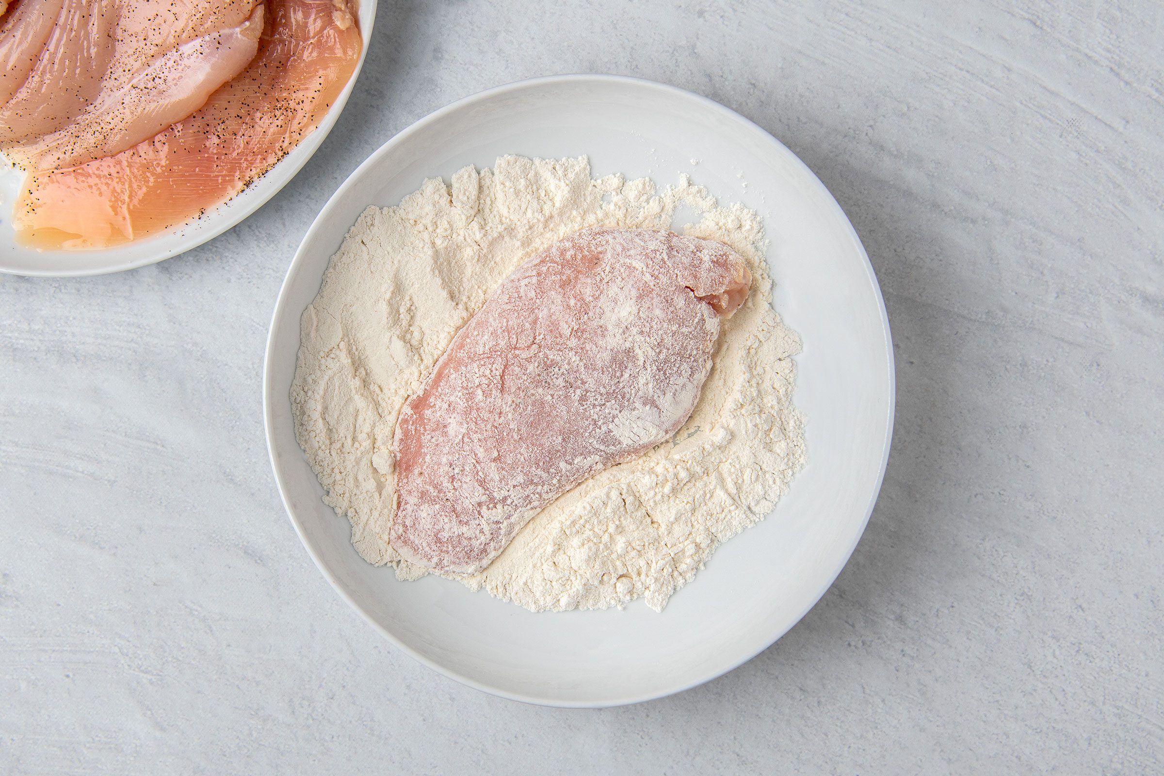 Seasoned chicken coated in flour