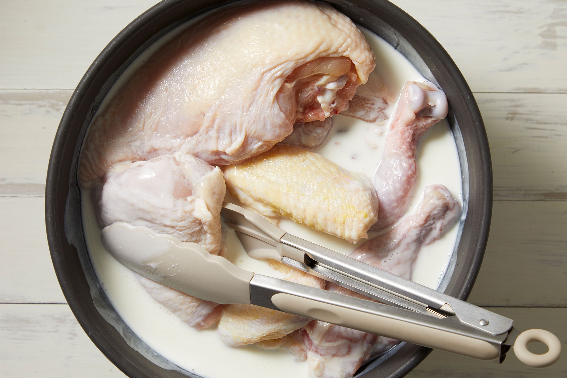 Chicken tossed to coat vinegar and buttermilk whisked together