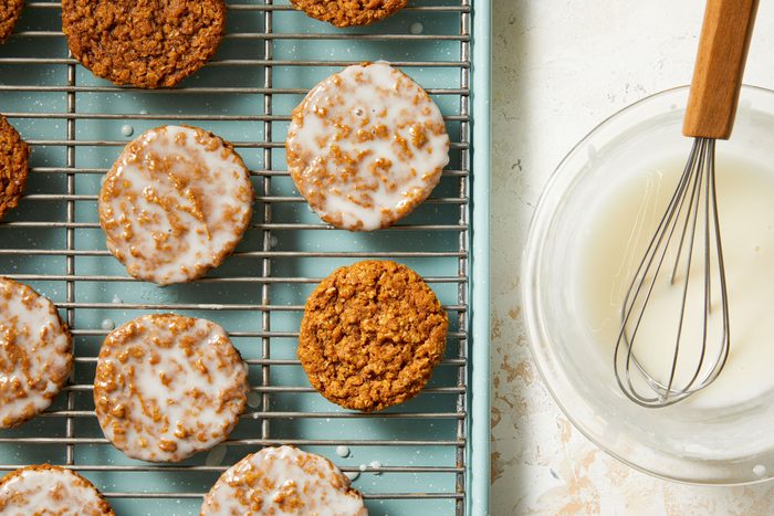 Milk, vanilla extract and confectioners' sugar whisked in a small bowl with cookies glazed with it