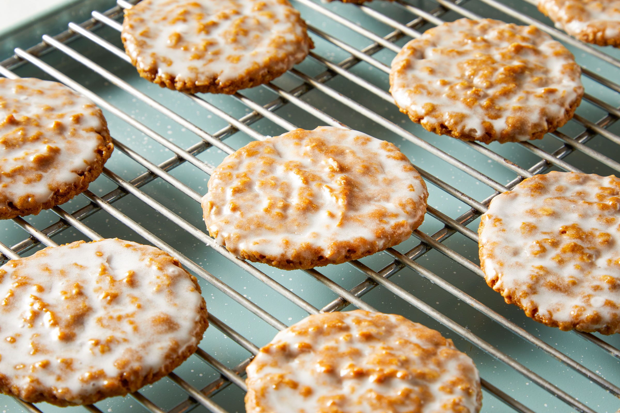 Iced Oatmeal Cookies on a wired rack