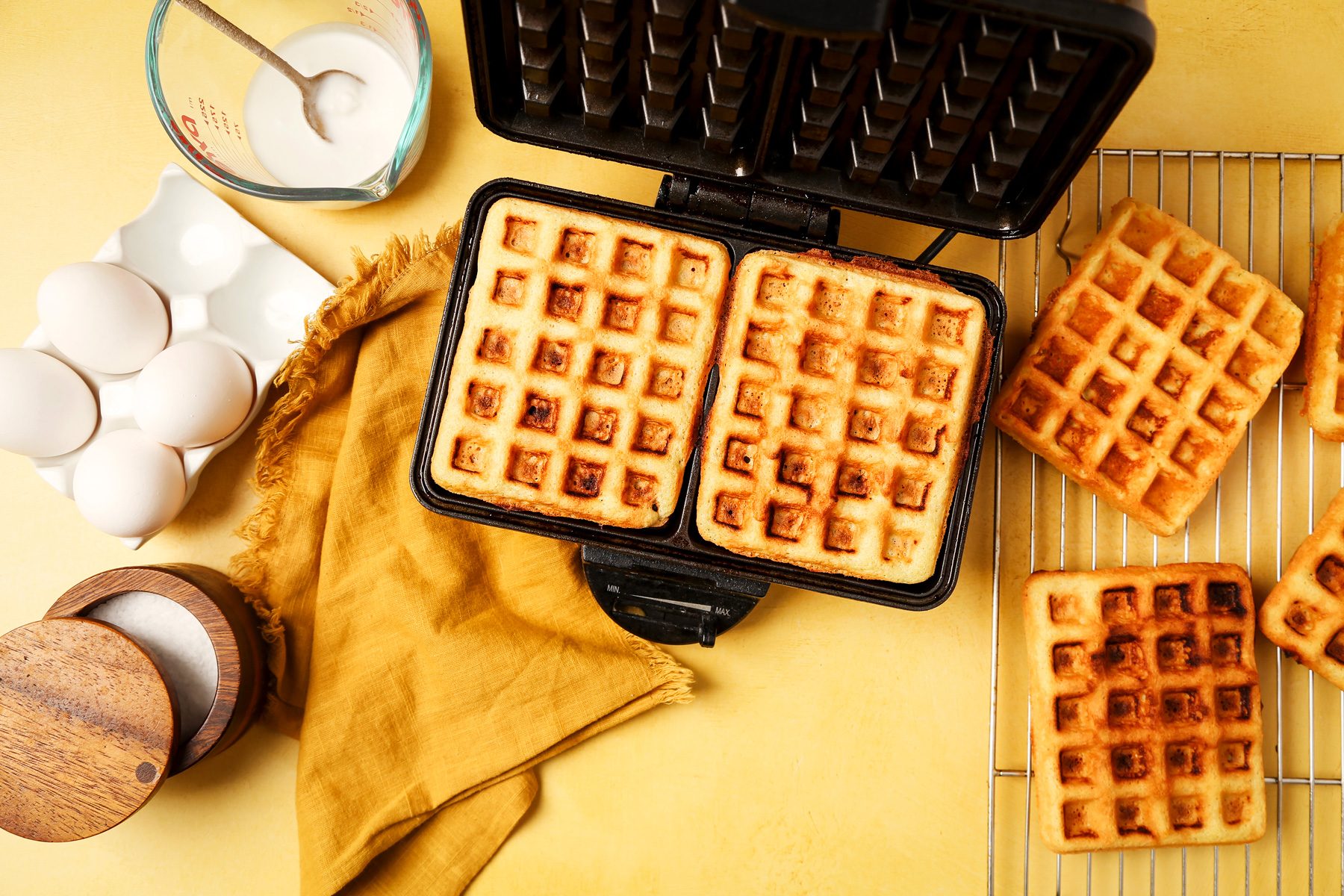Waffler batter mixed in a large mixing bowl with a whisk.