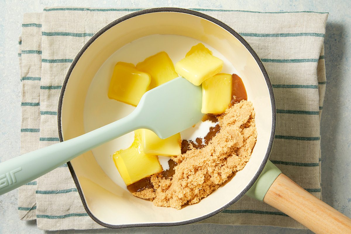 Overhead shot of a small saucepan combine glaze ingredients; bring just to a boil stirring constantly