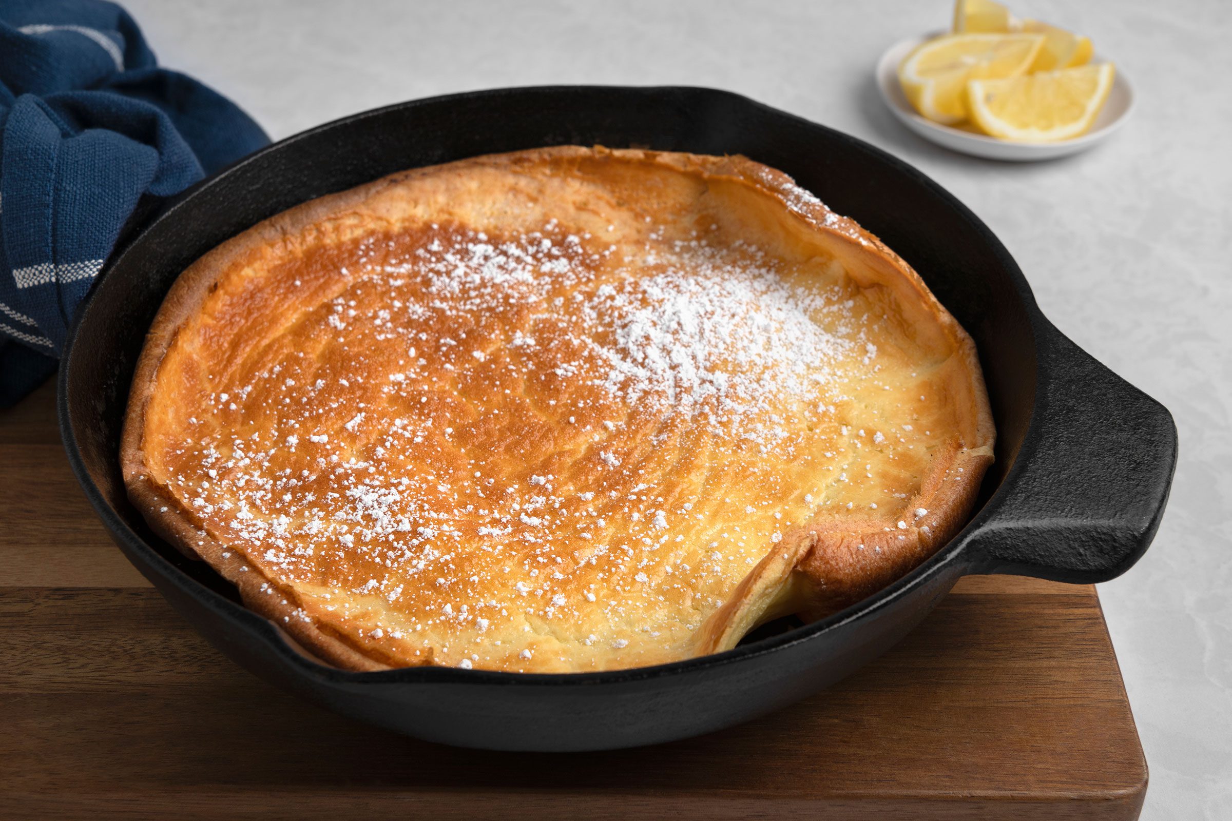 Dutch Baby Pancake with lemon wedges on side