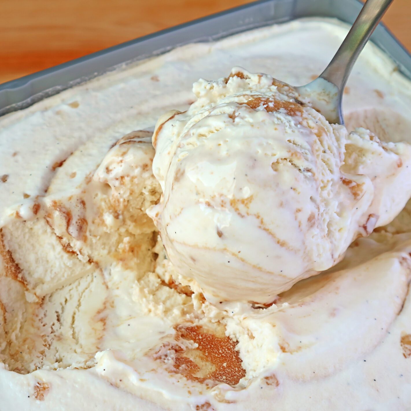 Spoon scooping ice cream out of a carton