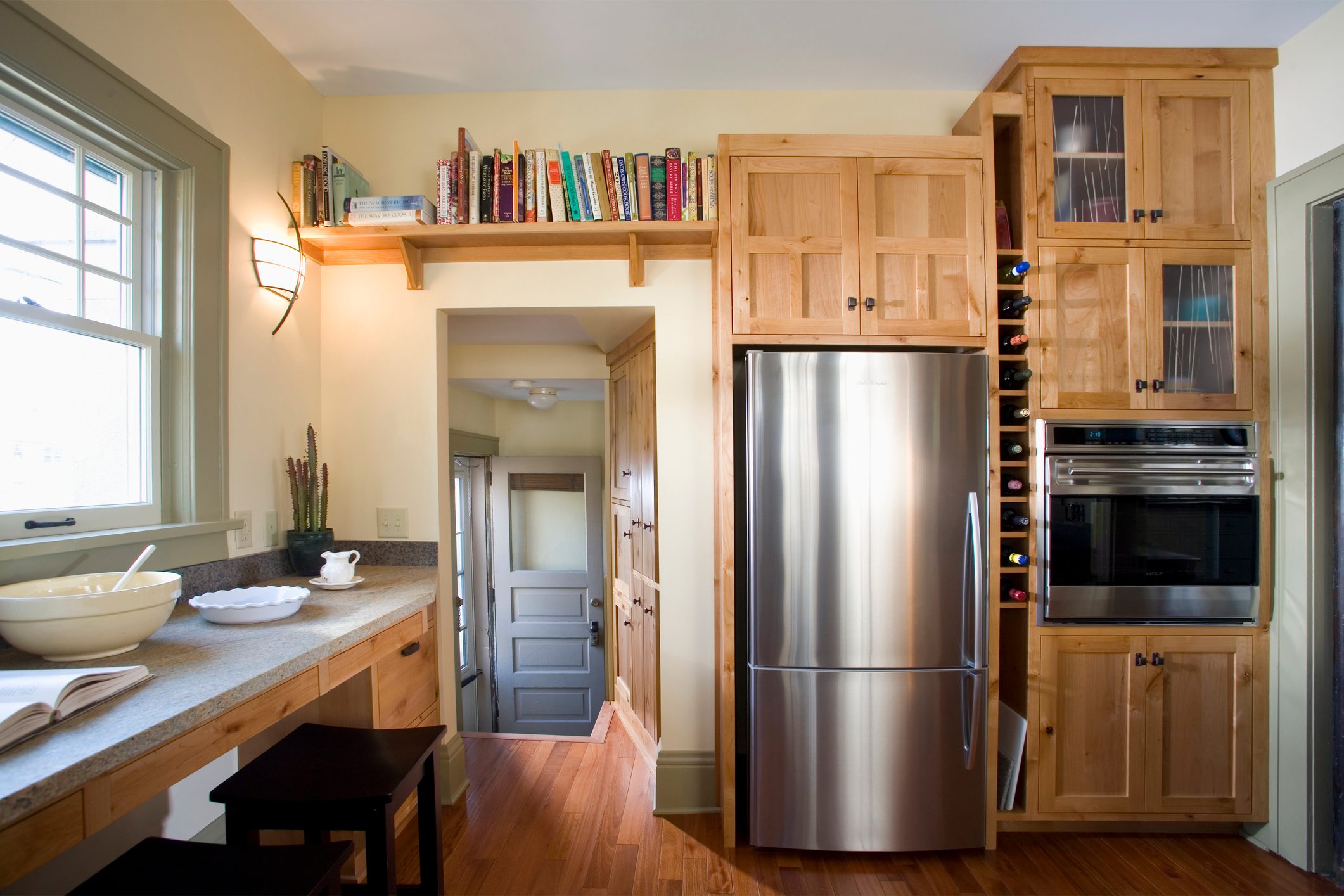 Kitchen with wooden cabinets and a stainless steel refrigerator