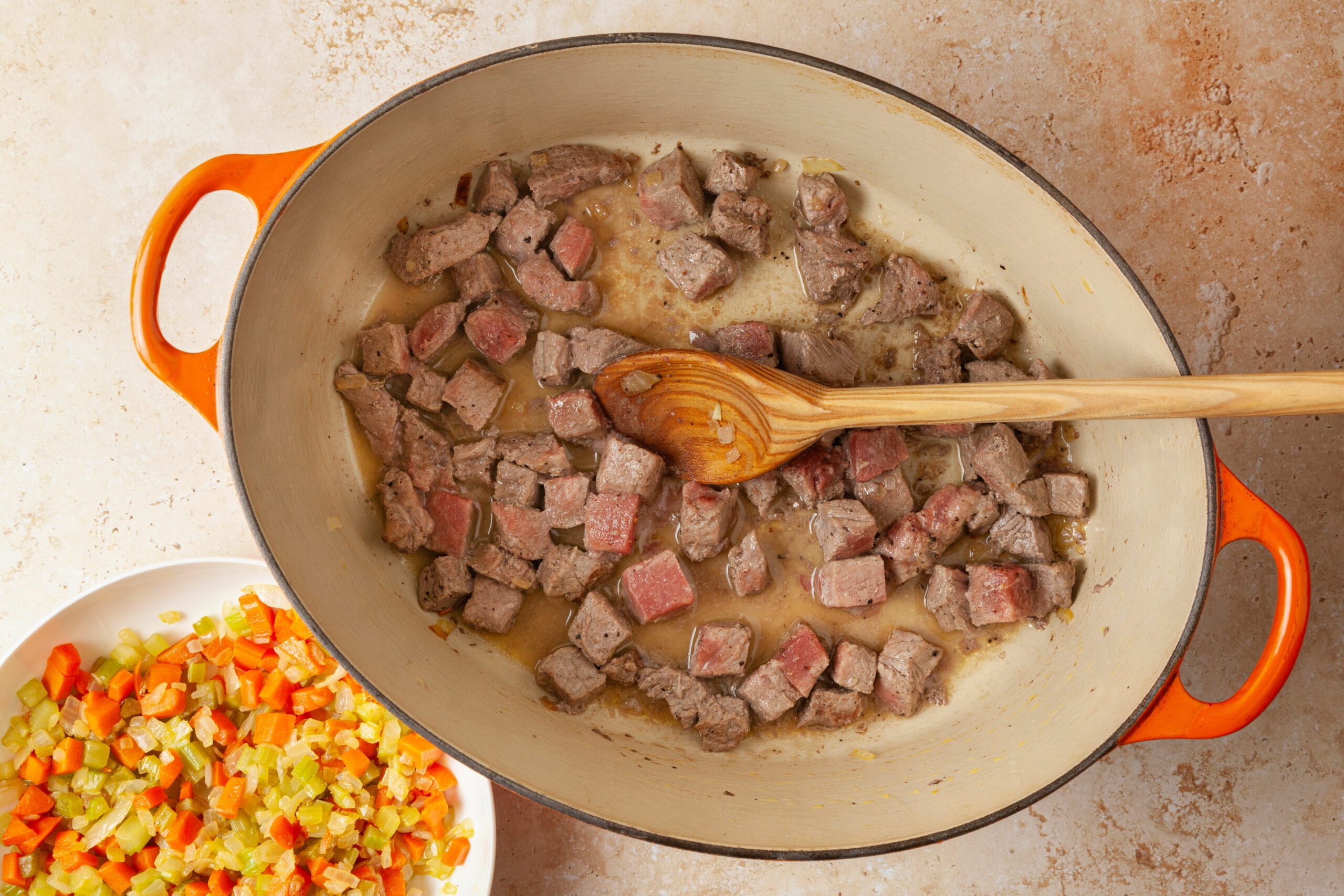 Meat cubes being cokked in a pot