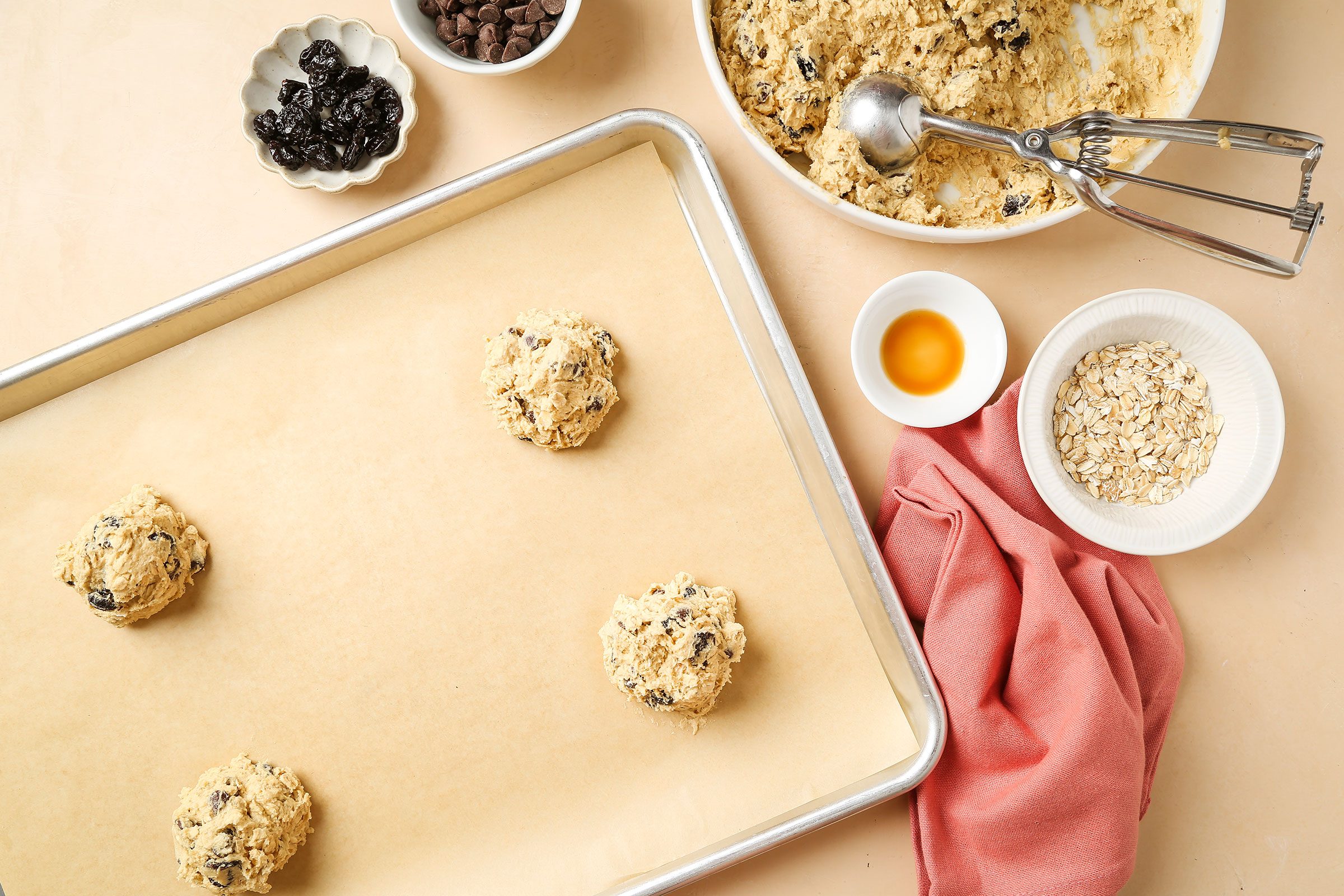 Dropped dough by scant 1/4 cupfuls, placed three inches apart onto non greased baking sheets