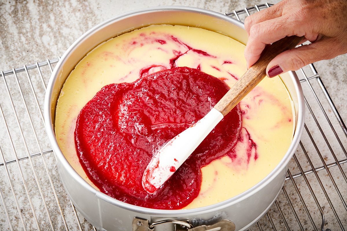 Pour remaining topping over cheesecake; Refrigerate cheesecake overnight; covering when completely cooled