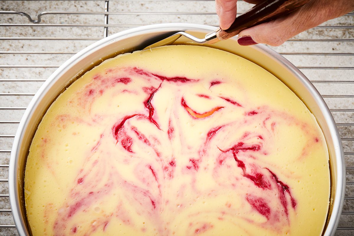Remove foil; Cool cheesecake on a wire rack 10 minutes; Carefully run a knife around edge of pan to loosen