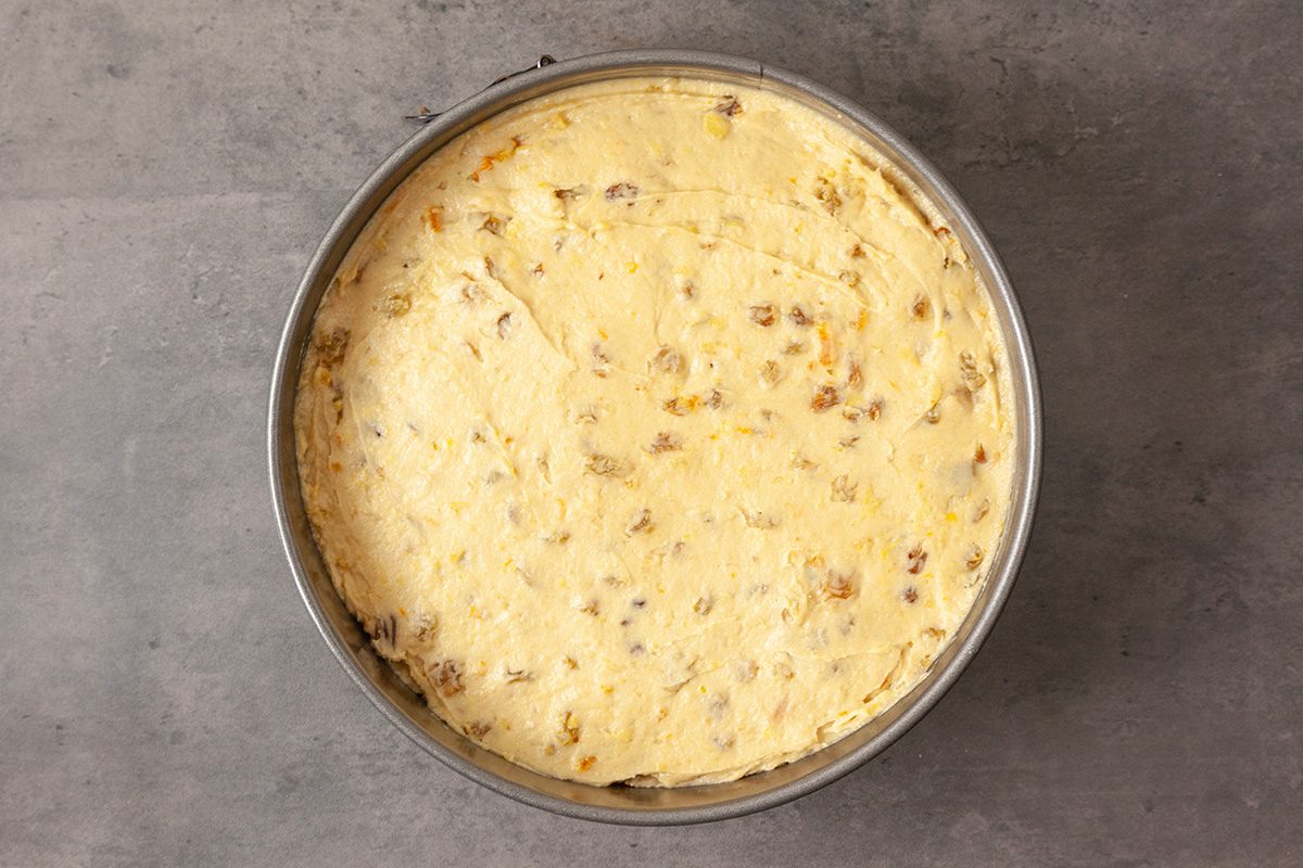 Transfer to the prepared cake pan; spread into an even layer.