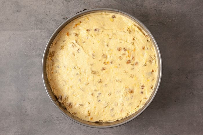 Transfer to the prepared cake pan; spread into an even layer.