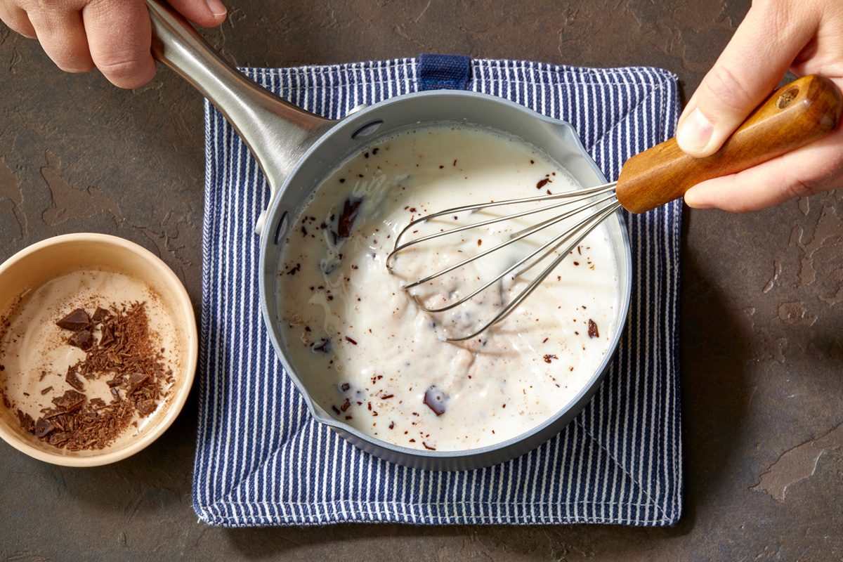 whisking dark chocolate in