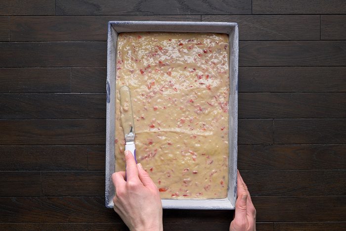 overhead shot of a prepared mix spread evenly on baking tray