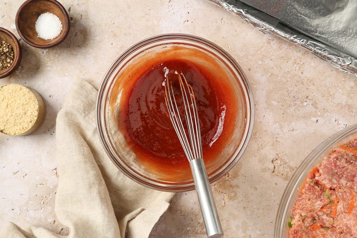 ketchup, brown sugar, white vinegar, Worcestershire sauce, garlic powder, onion powder and pepper mixed in a bowl