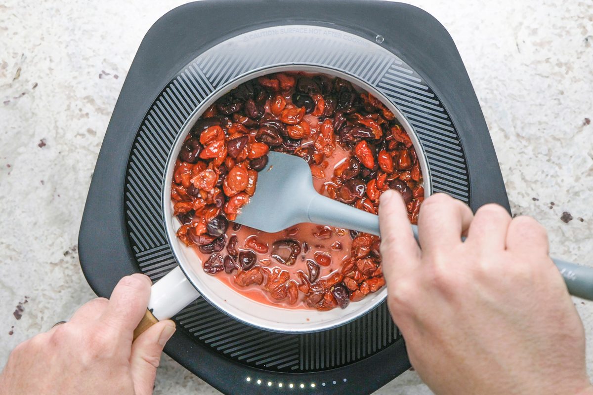 tart cherries and dark, sweet cherries mixed into the saucepan