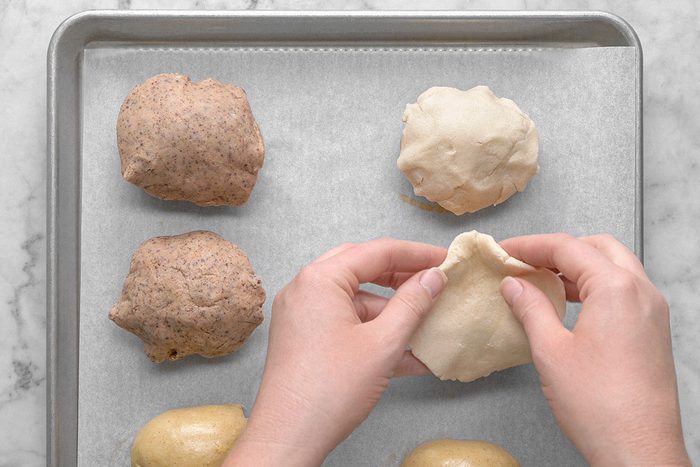 Topping being added on the dough roll