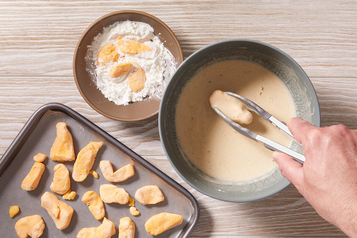 In a small bowl, toss cheese curds in cornstarch until well coated. Dip in batter; allow excess to drip off.