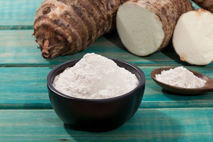 Taro Root of Colocasia esculenta and Organic Taro Flour in a bowl