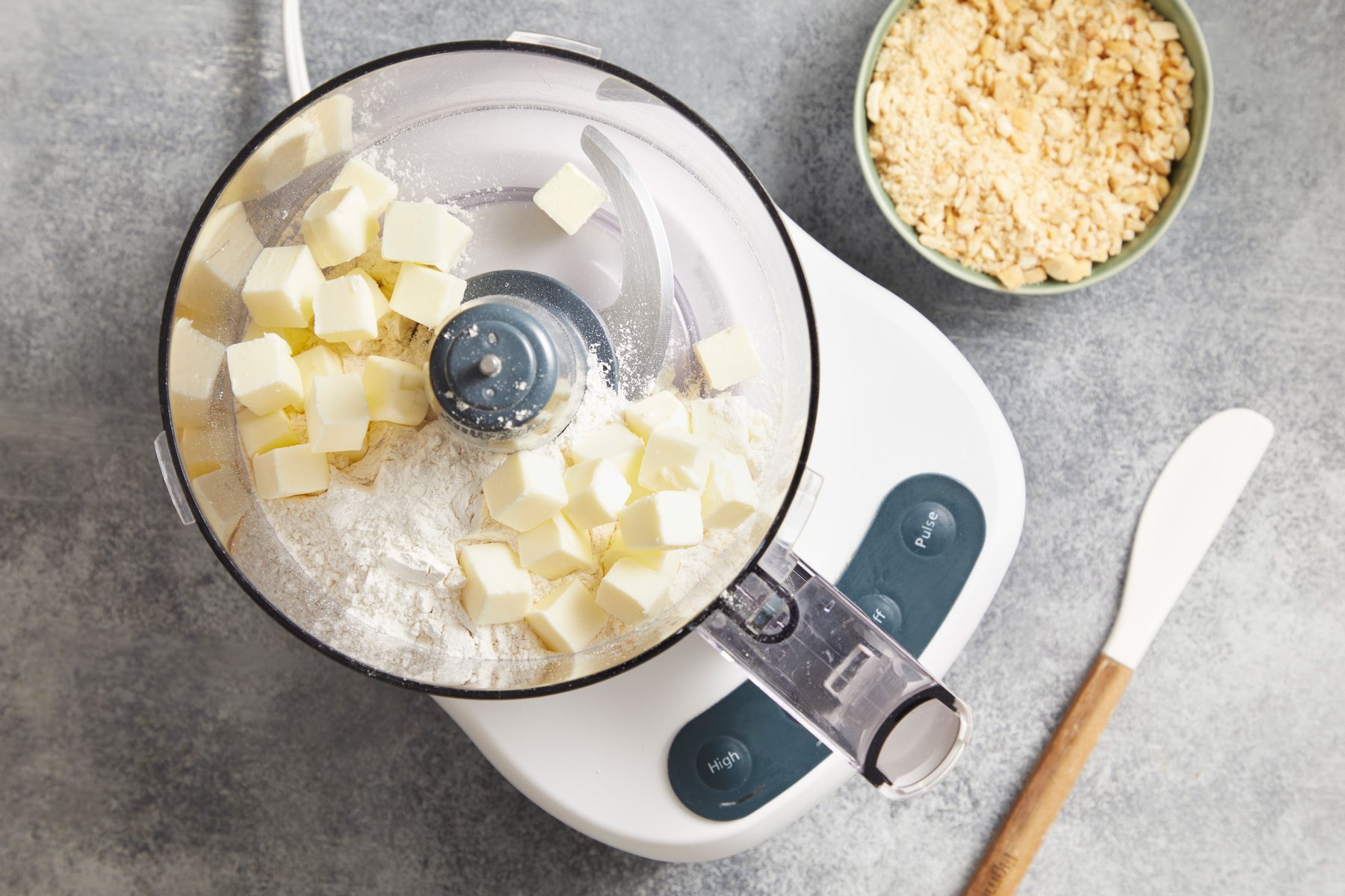 Place flour and butter in a food processor; cover and process until mixture resembles coarse crumbs.