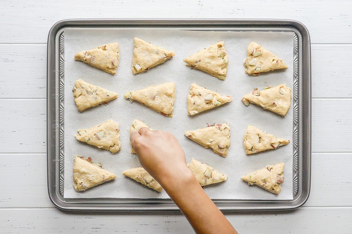 dough wedges on parchment-lined baking sheets sprinkled with coarse sugar
